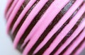 Closeup of Detail of Chocolate Cake Truffle Coated with Strawberry Icing