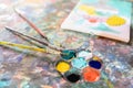 Closeup,artistic tools on colourful table,drawing and palette, paintbrush to painting watercolor on canvas,learning,activity and Royalty Free Stock Photo