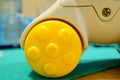 Closeup ashot of a yellow wheel of a toy car Royalty Free Stock Photo