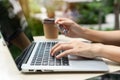 Closeup of Asian businesswoman typing on computer while holding credit card, Female shopping online or booking ticket. New normal Royalty Free Stock Photo