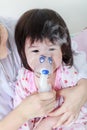 Closeup asian child having respiratory illness helped by health