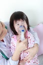 Closeup asian child having respiratory illness helped by health
