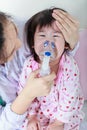 Closeup asian child having respiratory illness helped by health