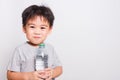 Closeup Asian face, Little children boy drinking water from Plastic bottle