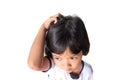 Closeup asian girl head scratches caused by diseases of the scalp of children. it is lice and fungus on the scalp. cause itching Royalty Free Stock Photo