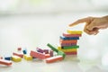 Closeup of asian kids hand playing wood blocks stack game