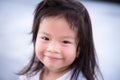 Closeup Asian little cute girl with a sweet smile. Child looking at the camera. Happy children. Adorable kids aged 3-4 years old Royalty Free Stock Photo