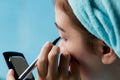 Closeup asian woman applying eyeliner on eye Royalty Free Stock Photo