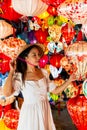 Closeup of Asian woman is enjoy looking lanterns in old town Hoi An, Woman choosing a lamp at Hoi An ancient town, Vietnam Royalty Free Stock Photo