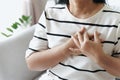 Closeup of asian woman having heart attack. Woman touching breast and having chest pain. Healthcare And Medical concept Royalty Free Stock Photo