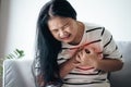 Closeup of Asian woman having heart attack. Woman touching breast and having chest pain. Healthcare And Medical concept Royalty Free Stock Photo