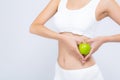 Closeup asian woman holding green apple fruit shape heart and beautiful body diet with fit isolated Royalty Free Stock Photo