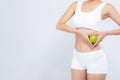 Closeup asian woman holding green apple fruit shape heart and beautiful body diet with fit isolated on white background Royalty Free Stock Photo