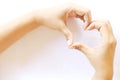 Asian woman make her hand like heart shape sign of love on white background Royalty Free Stock Photo