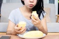 Asian woman over eating Durian fruit, unhealthy lifestyle