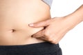 Closeup of asian woman pinching belly fat.
