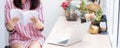 Closeup asian woman relax sitting reading book in living room at home, girl study literature Royalty Free Stock Photo