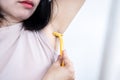 closeup asian woman shaving armpits to remove hair underarm by using razor Royalty Free Stock Photo