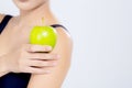 Closeup asian woman smiling holding green apple fruit and beautiful body diet with fit isolated Royalty Free Stock Photo