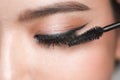 Closeup Asian women using mascara. Royalty Free Stock Photo