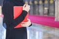 Closeup asian young muslim woman holding red Quran. Royalty Free Stock Photo