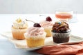 closeup assorted cupcakes with sprinkles on a plate Royalty Free Stock Photo