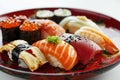 closeup assorted set of tasty appetizing sushi and roll on red plate Royalty Free Stock Photo