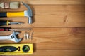 Closeup of assorted work tools on wood