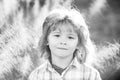 Closeup attractive boy outdoor. Portrait of young smiling child. Kids emotions concept. Blur background. Royalty Free Stock Photo