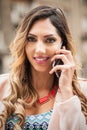 Closeup of attractive fashion woman talking on mobile cellphone phone Royalty Free Stock Photo