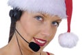 Closeup of attractive female call center telephonist wearing Christmas Santa hat Royalty Free Stock Photo