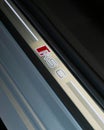 Closeup of the Audi RS6 illuminated door sill with the model name on it