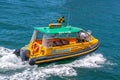 Closeup of Aussie water taxi on blue bay water in Sydney, Australia Royalty Free Stock Photo