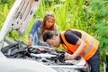 Closeup auto mechanic checking for breakdowns and list repairs according to customer orders