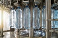 Closeup of an automated conveyor for bottling mineral water