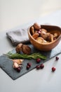 Closeup of autumn fruits and mushrooms in a wooden bowl Royalty Free Stock Photo