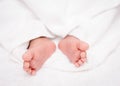 Closeup baby feet on a white blanket Royalty Free Stock Photo