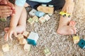 Closeup of baby learning with toys, block puzzle and train to help hand eye coordination on floor in home. Young child Royalty Free Stock Photo