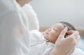 Closeup a baby girl in the mother`s arms Royalty Free Stock Photo