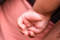 Baby palm hand fingers closeup