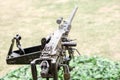 Closeup and back view of M2 .50cal Browning machine gun with tripod standing in bunker Royalty Free Stock Photo