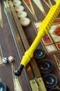 Closeup of a Backgammon game board with dice and black and white pieces Royalty Free Stock Photo