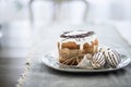 Closeup, background, Easter bread on a plate with three eggs, copy space Royalty Free Stock Photo