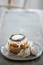 Closeup, background, Easter bread on a plate with three eggs, copy space Royalty Free Stock Photo