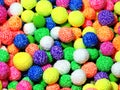 Closeup background foam plasticine multicolored rolled airy balls