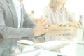 Closeup.background image of business colleagues sitting at the table.