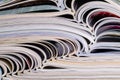 Closeup background of a pile of magazines