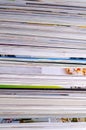 Closeup background of a pile of magazines