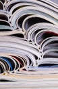 Closeup background of a pile of magazines