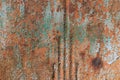 Closeup background of ridged metal with crazed paint and rust texture, copy space